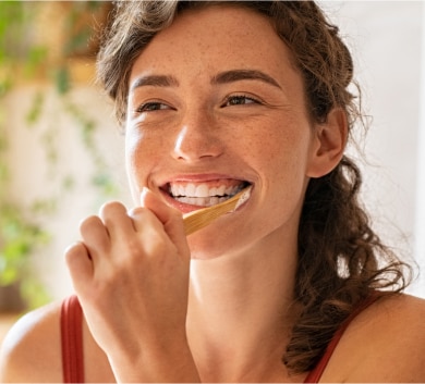 Young woman brushing her teeth