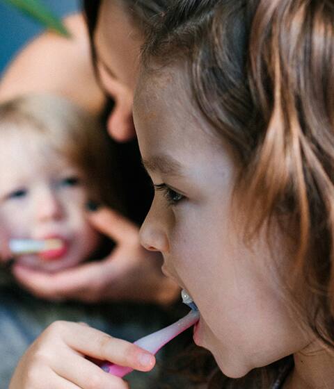 Little girl brushing her teeth