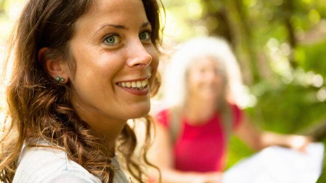 Side view of woman with wide smile